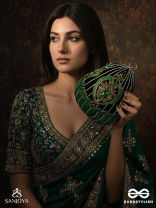 MEHREENA – OVAL DARK GREEN VELVET CLUTCH WITH INTRICATE HANDWORK AND GOLDEN METAL FRAME