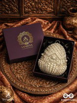SAHIBA  – OVAL IVORY SILK CLUTCH WITH PEARL EMBEDDING AND GOLDEN METAL FRAME