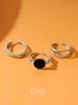  THREE-WAY- SET OF THREE BLACK AND SILVER RINGS