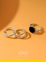  THREE-WAY- SET OF THREE BLACK AND SILVER RINGS