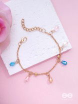 The Shimmering Sleet- Pearl and Crystals Studded Golden Bracelet