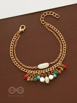 The Divine Galaxy- Pearls and Beads Studded Golden Bracelet