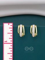 A CLASSY DAME - WHITE ENAMELLED GOLDEN STUDS