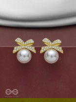 BOW-DAZZLE PEARLS - GOLDEN AND WHITE EMBELLISHED EARRINGS