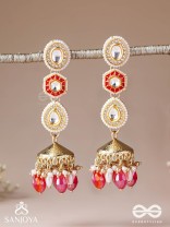 Suvarnmani - The Golden Gem –Golden enamel earrings adorned with gemstones and dangling beads