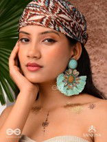 Vibhusitpuspa - the adorned flower - embroidered flower earrings with turquoise tassles