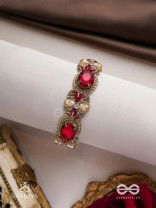 Sundarasūra- Beautiful Wine- Bracelet with rich hue of the red stones and twisted thread work.