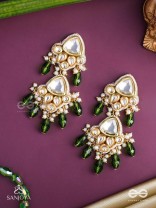 Kundalāṅgī-Kundan Elegance- Traditional pearl and Kundan earrings adorned with beads, stones, and green danglers for a regal touch.