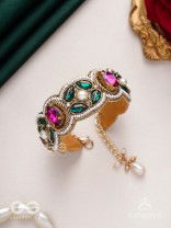 Tarangini-Wavy beauty-opulent bracelet embedded with purple and green stones