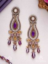 Divyaśhobhanā-Divine Splendour-Lotus-inspired embroidered design, adorned with purple and golden gem-studded motifs, Pearl and Beads.