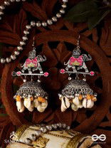 GAJASANKHA KARṆIKA- ELEPHANT-SHELL EARRINGS- OXIDIZED EARRINGS FEATURING AN ELEGANT MOTIF, DELICATE GHUNGHROO'S, AND COWRIE SHELLS