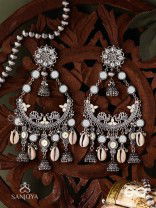 CHANDRAMAYURA- MOON-PEACOCK EARRINGS- OXIDIZED CHAANDBAALI EARRINGS, ADORNED WITH MIRRORS, GHUNGHROOS, COWRIE SHELLS, AND DANGLING JHUMKA