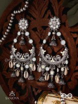 CHANDRAMAYURA- MOON-PEACOCK EARRINGS- OXIDIZED CHAANDBAALI EARRINGS, ADORNED WITH MIRRORS, GHUNGHROOS, COWRIE SHELLS, AND DANGLING JHUMKA