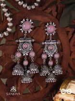 VIJAYAMUKTA-VICTORY PEARLS- REGAL OXIDIZED EARRINGS WITH A CENTRAL PURPLE STONE AND LAYERED JHUMKAS