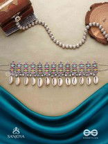 SHANKHAMALA-CONCH GARLAND- OXIDIZED NECKPIECE FEATURING PASTEL-COLOURED METALWORK, EMBELLISHED WITH DANGLING COWRIE SHELLS AND GHUNGROO'S