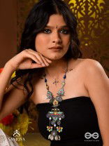 Rangapadma-Color bloom- Enamelled Neckpiece with cowrie shells,mirror and colorful gemstones on oxidized metalwork.