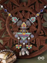 Rangapadma-Color bloom- Enamelled Neckpiece with cowrie shells,mirror and colorful gemstones on oxidized metalwork.