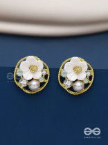 Divine temptation- white floral studs encircled with golden mesh 