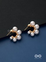 Plush desires- Golden circular earrings with studded pearls 