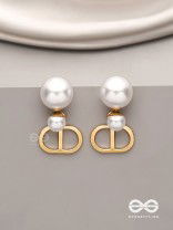 Starlit orb- dangling pearl earrings with golden spheres 