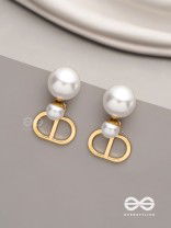 Starlit orb- dangling pearl earrings with golden spheres 