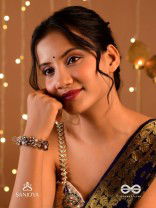 SHYAMALIKA – DARK BLOOM A FLORAL-INSPIRED BRACELET ADORNED WITH DARK-HUED GEMSTONES AND PEARLS