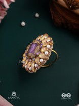 KANAKA PUSHPA – GOLDEN FLOWER EMBROIDERED FLOWER-SHAPED RING ADORNED WITH YELLOW GEMS AND PEARLS, GIVING A GOLDEN GLOW