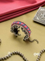 CHITRA DHARA – FLOW OF COLORS   EMBROIDERED BRACELET WITH A MIX OF COLORS AND INTRICATE THREAD WORK, ADORNED WITH GHUNGROO'S