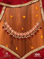 RUDRANJALI - SACRED RED OFFERING- TRADITIONAL RED ENAMELLED POLKI CHOKER WITH LUSTROUS BEADS AND PEARLS