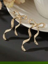 WISP KNOT- SOFT AND CURVY BOW INSPIRED EARRINGS