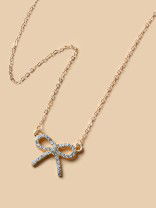 TIED IN GOLD- MINIMALIST BOW NECKPIECE