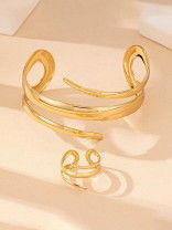 AURIC SWIRL - CONTEMPORARY GOLDEN TWIST RING+ TWISTED GLEAM- SLEEK AND POLISHED METALLIC CUFF BRACELET