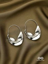 SILVER DRIFT- SCULPTED SILVER HOOPS WITH A FLUID