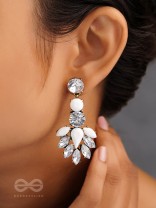 The pious touch white enigmatic stones studded earrings 