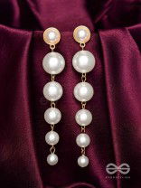 Elegance is a deadly weapon- white pearls statement earrings