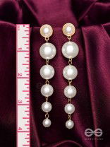 Elegance is a deadly weapon- white pearls statement earrings