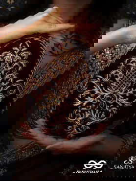 NOOR – OVAL MAROON VELVET CLUTCH WITH RICH ZARDOZI EMBROIDERY AND GOLDEN METAL FRAME