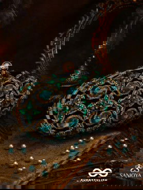 NEELZARA – OVAL DARK GREEN VELVET CLUTCH WITH INTRICATE STONE AND ZARDOZI WORK AND GOLDEN METAL FRAME