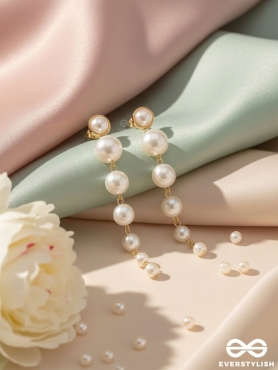 Elegance is a deadly weapon- white pearls statement earrings