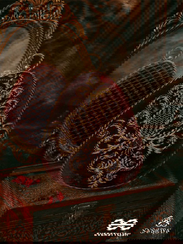 NOOR – OVAL MAROON VELVET CLUTCH WITH RICH ZARDOZI EMBROIDERY AND GOLDEN METAL FRAME