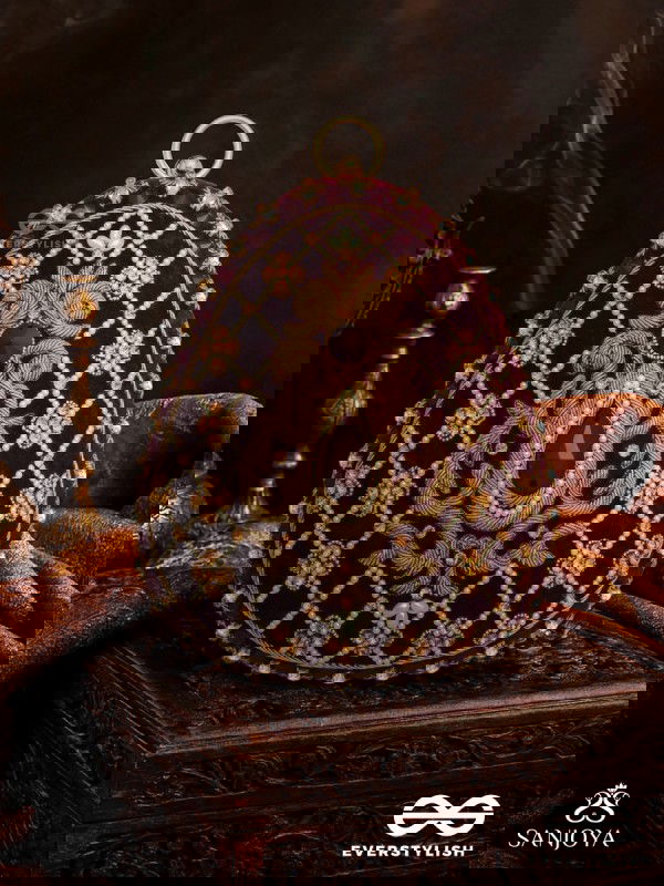 SHAHNAZ – OVAL MAROON VELVET CLUTCH WITH INTRICATE ZARDOZI EMBROIDERY AND GOLDEN METAL FRAME