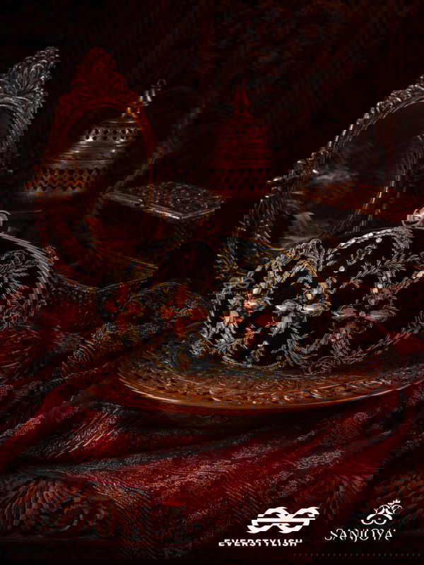 ROHINI – POLISHED BRONZE BROWN TEXTILE CLUTCH WITH FACETED JEWEL ACCENTS AND GOLDEN METAL FRAME