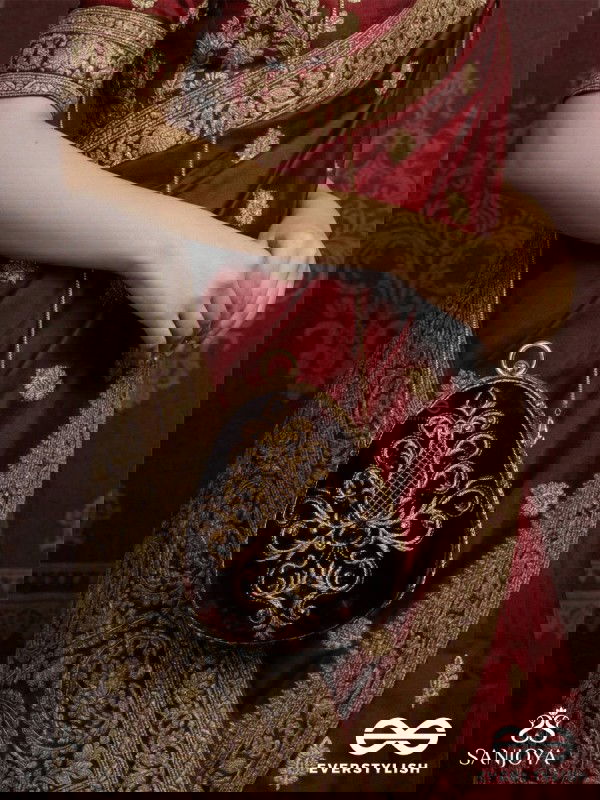 NOOR – OVAL MAROON VELVET CLUTCH WITH RICH ZARDOZI EMBROIDERY AND GOLDEN METAL FRAME