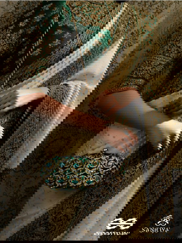 NEELZARA – OVAL DARK GREEN VELVET CLUTCH WITH INTRICATE STONE AND ZARDOZI WORK AND GOLDEN METAL FRAME