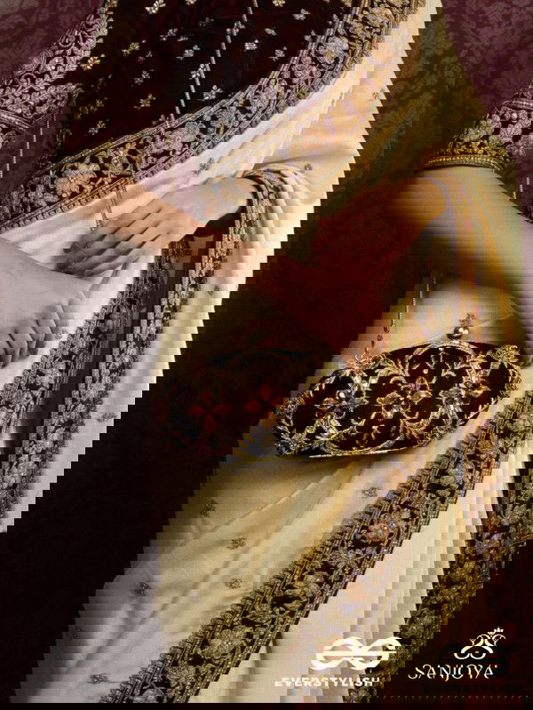 ROHINI – POLISHED BRONZE BROWN TEXTILE CLUTCH WITH FACETED JEWEL ACCENTS AND GOLDEN METAL FRAME