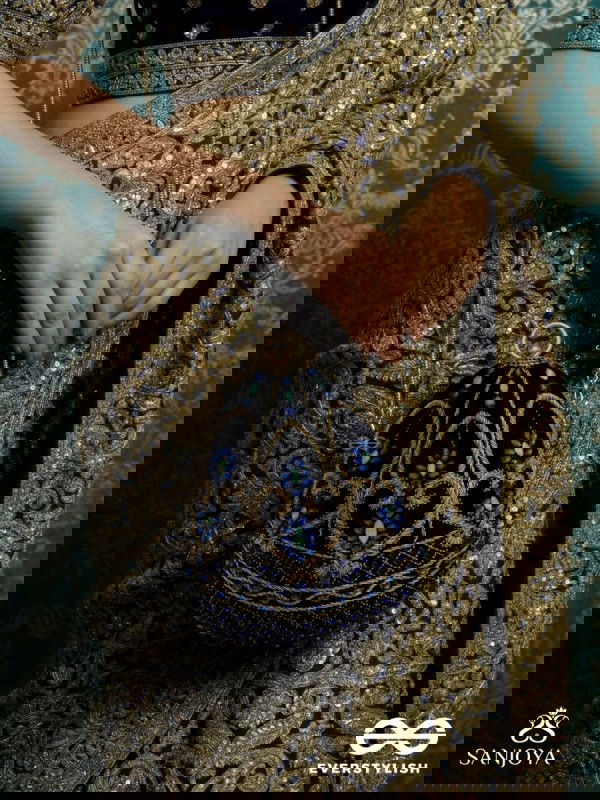 SITARAA – POLISHED OVAL ROYAL BLUE VELVET CLUTCH WITH STONE-ACCENTED HANDWORK AND GOLDEN METAL FRAME