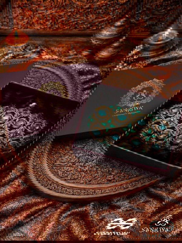 NEELZARA – OVAL DARK GREEN VELVET CLUTCH WITH INTRICATE STONE AND ZARDOZI WORK AND GOLDEN METAL FRAME