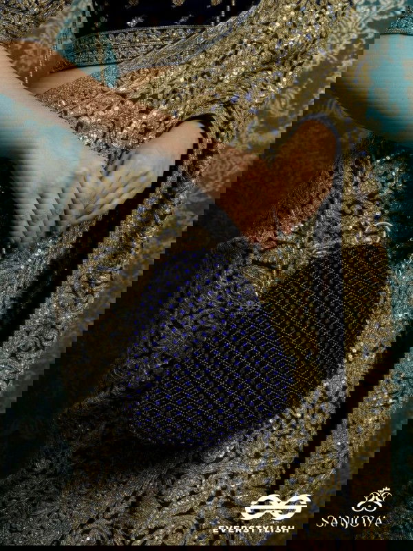 SITARAA – POLISHED OVAL ROYAL BLUE VELVET CLUTCH WITH STONE-ACCENTED HANDWORK AND GOLDEN METAL FRAME