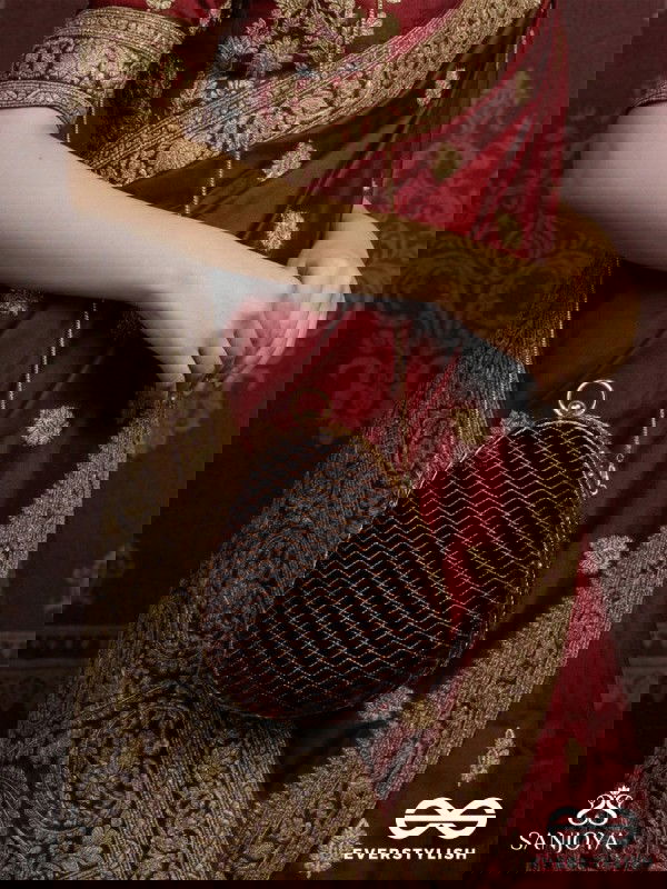 NOOR – OVAL MAROON VELVET CLUTCH WITH RICH ZARDOZI EMBROIDERY AND GOLDEN METAL FRAME