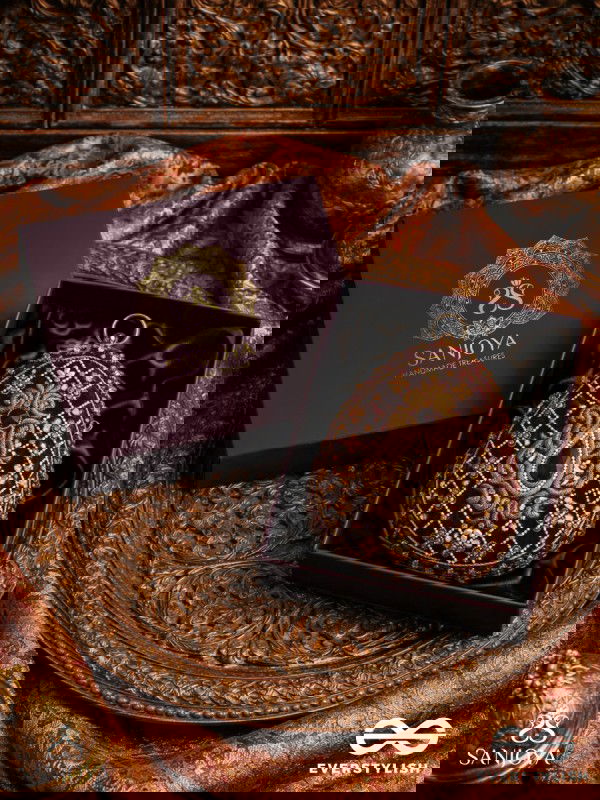 SHAHNAZ – OVAL MAROON VELVET CLUTCH WITH INTRICATE ZARDOZI EMBROIDERY AND GOLDEN METAL FRAME